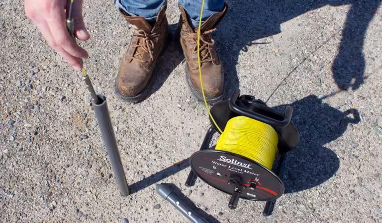 A man using water level meters
