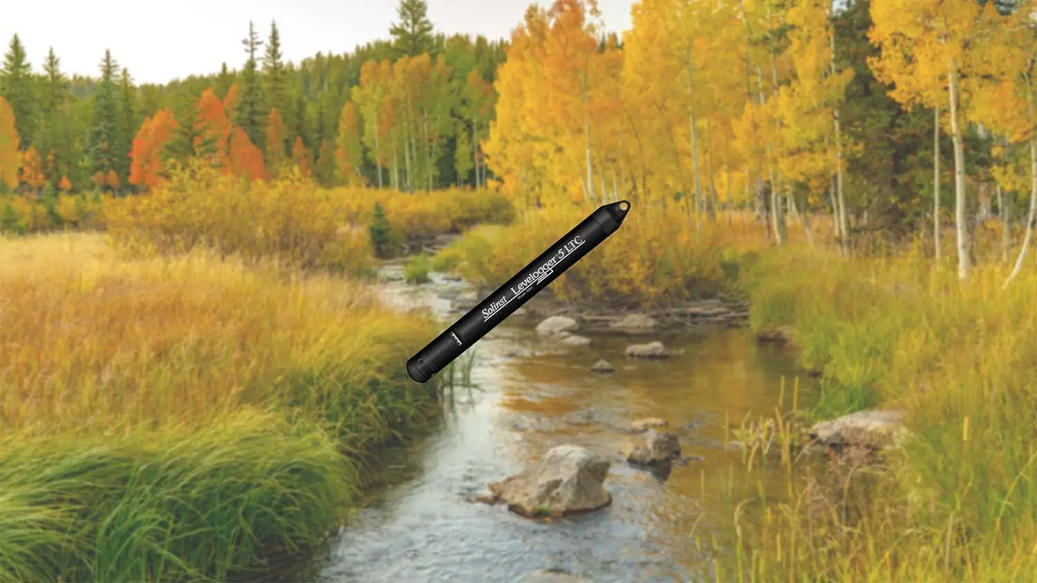 a Solinst Levelogger overlayed across a fall scene
